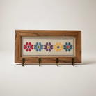 Floral cross-stitch key holder with hooks