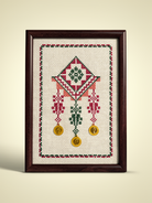 Framed diamond Palestinian tatreez with hanging coins